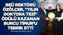 BEÜ Rektörü Özölçer, "Yılın Doktora Tezi" ödülü kazanan Burcu Timur'u tebrik etti.