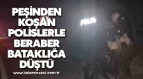 Peşinden koşan polislerle beraber bataklığa düştü